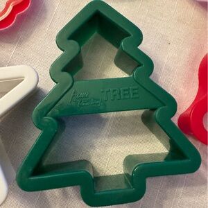 3 Acme cookie cutters from 2000; 12 smaller cookie cutters (6 red 6 green)